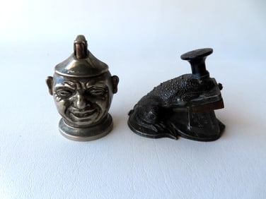Two unusual collectibles: A toad shaped metal seal press with brass plate marked "A.R. HOLMAN /