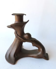 An Arts & Crafts candlestick by Bernhard Johannes Karl Butzke (German 1876 - 1952) in the Art