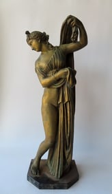 A gilded bronze (or brass) classic sculpture of a Greek Goddess, mounted on a slate or marble base.