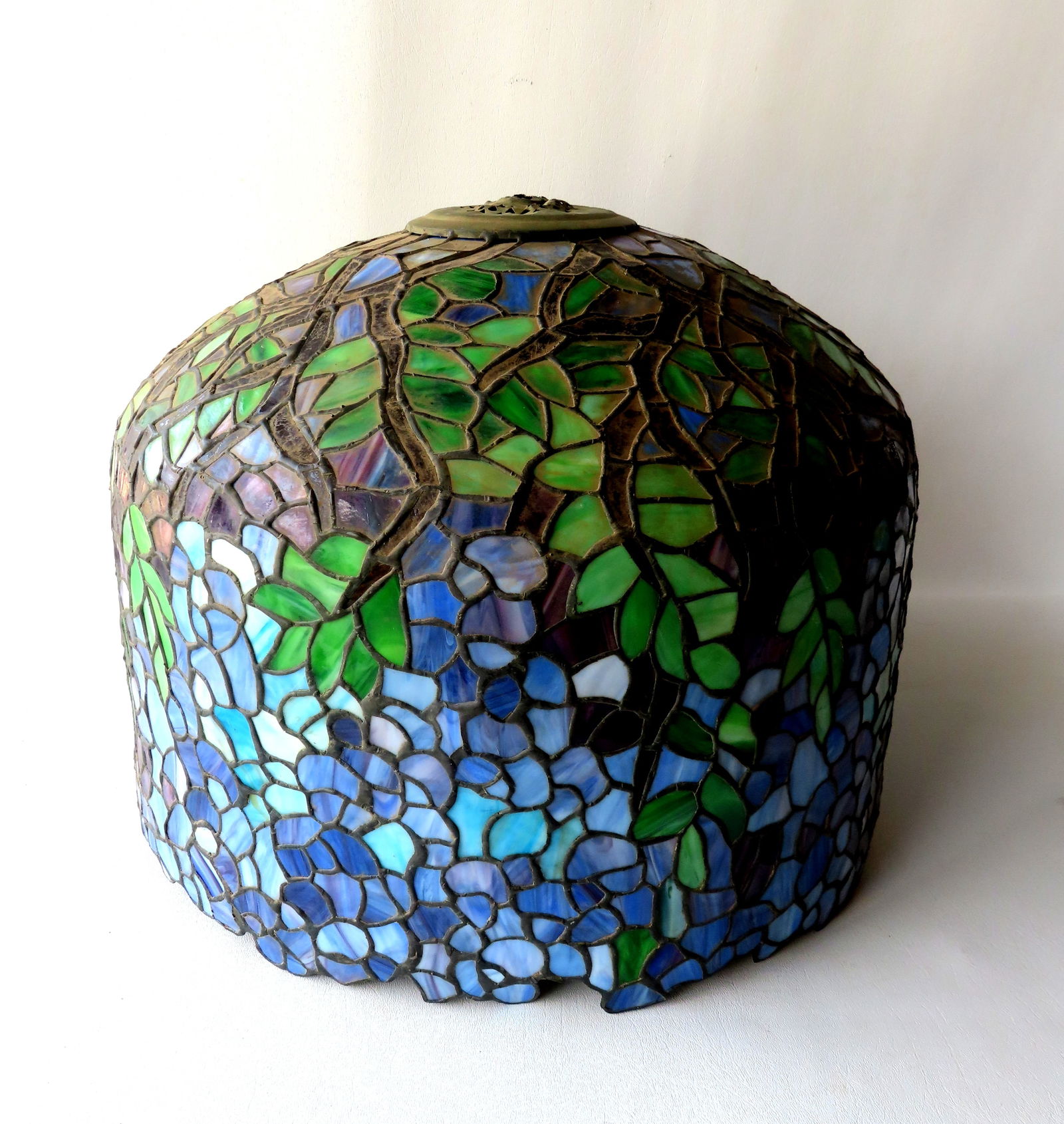 A Wisteria pattern leaded and slag glass lamp shade, unknown maker, probably mid to late 20th (1 of 9)