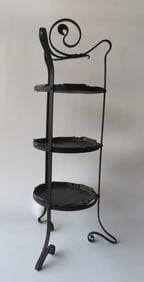 A very fine Arts & Crafts wrought iron muffineer stand with 3 removable hand made copper trays