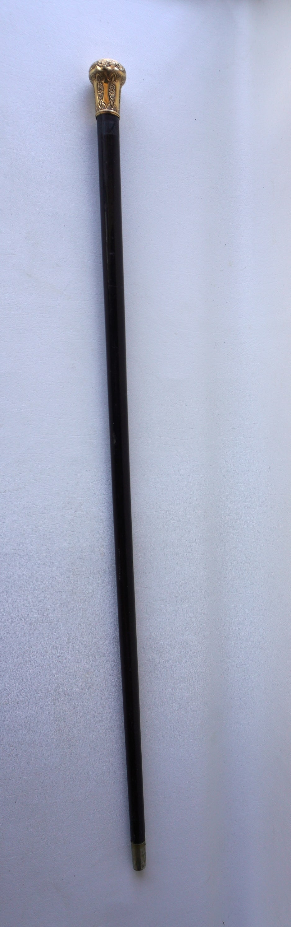 A Christmas gift presentation ebony walking stick with heavily engraved gold handle marked "L.P. (1 of 10)