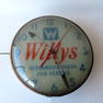 A Willys Jeep advertising clock marked "Willys Authorized Sales and Service". Some wear to the