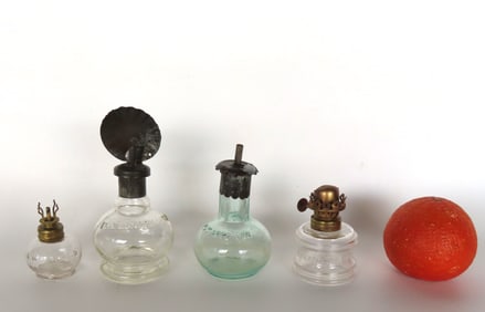 Grouping of 4 unusual miniature colorless fluid and oil lamps, all in good condition. 1) Signed