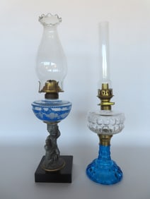 Two Victorian oil lamps. 1) Pressed glass font over brass collar over pressed blue glass base - very