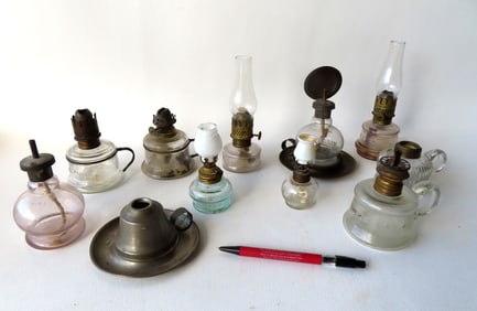 Grouping of 11 miniature oil lamps including:  Two marked "The Handy Night Lamp" - one of these