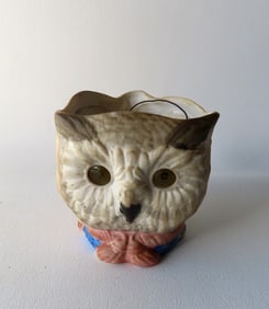 A porcelain 3 face Fairy lamp, featuring a dog face, cat face and owl face on the sides of the lamp,
