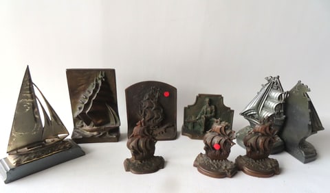 Grouping of 9 metal bookends in the form of sailing ships, 2 matching pairs