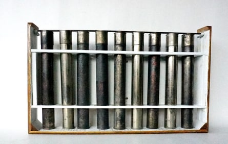 A mounted grouping of 9 tin covered cylinders signed "Fischer Scientific Co. Pa." - housed in a home