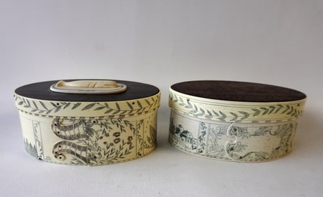 Two reproduction resin ditty boxes, with original Artek papers. One with a carved whale on the lid,