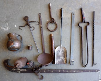 Grouping of iron utility collectibles including scales, fireplace poker and tongs, ladle, a