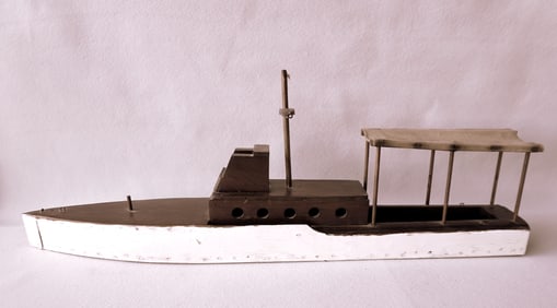 A handmade cruiser boat model with canvas covered canopy, in original paint, circa 1930-50 - good