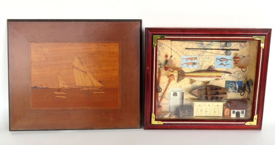 A hand made fishing diorama decorated with fish, rowboat, dobbers, fishing poles, harpoons, etc. -