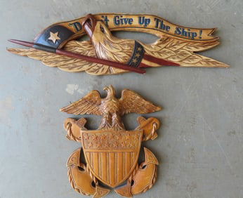 Two hand carved patriotic wall plaques. The first, designed after a Bellamy plaque, depicting a