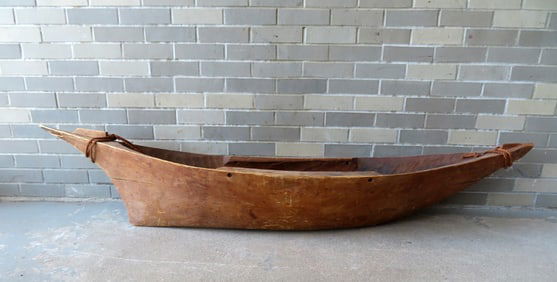 A traditional dugout canoe , probably Solomon Islands, 19th century.