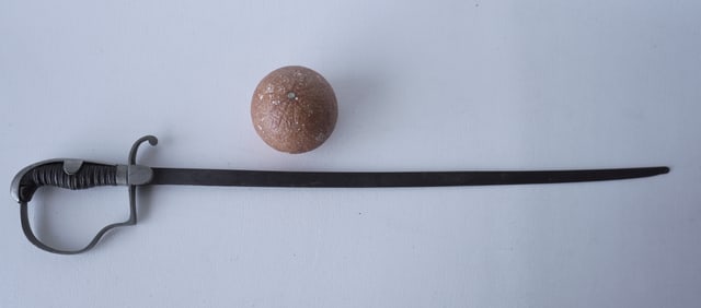 A child's sword with carved wooden grip double wrapped in wire, and with an engraved blade and blunt