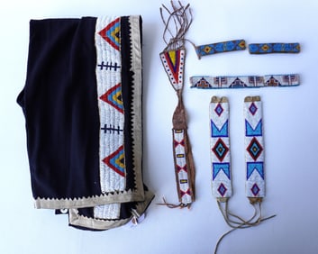 A grouping of Native American made textiles, circa 1900-50, including: Trousers with beaded leg