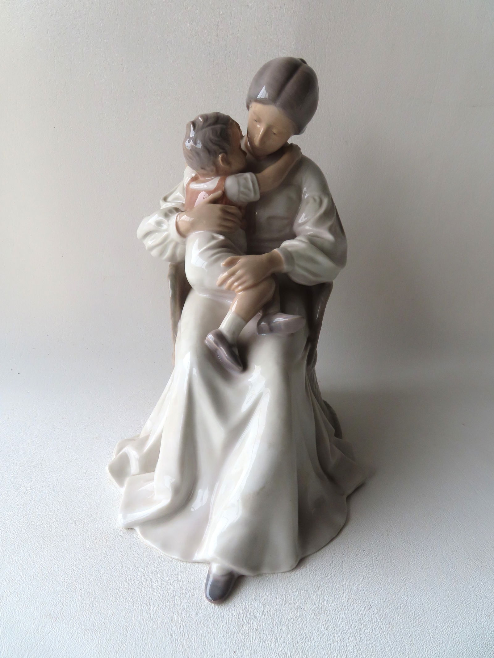 Large Bing & Grondahl porcelain sculpture of seated lady holding small boy her lap, Denmark #1552. (1 of 6)