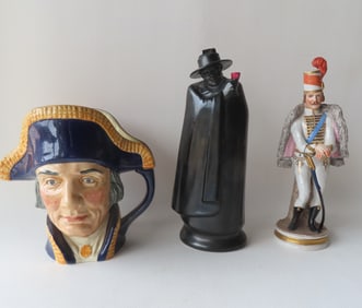 Three porcelain decorative objects including: Royal Doulton Toby mug of "Lord Nelson" - 7 3/4"W x 7