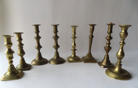 Grouping of 8 early brass candlesticks, late 18th to early 19th century, including 3 late 18t