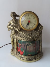 A Davy Crockett "United Self Starting" figural motion clock and night light with lighted 3