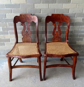 Two Empire tiger maple and birdseye maple side chairs with cane seats in good condition, circa