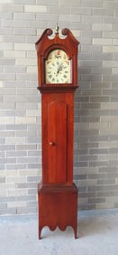 A mahogany Hepplewhite grandmother's clock,  early 19th century. The clock case with broken arch top