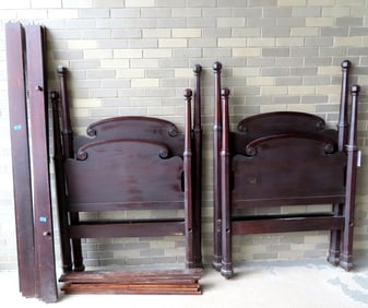 A pair of mahogany Sheraton style poster beds, each in good condition. Twin size.