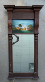A large Sheraton double panel wall mirror having a reverse painting farmhouse scene in the upper