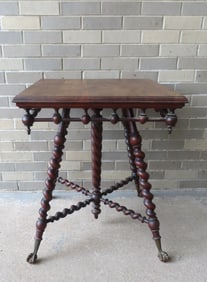 A high quality Victorian black walnut (or mahogany) parlor table with stick and ball apron