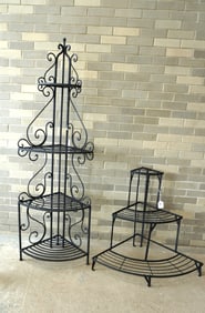 Two wrought iron corner plant stands, both in very good condition. The largest measures 21 1/2"W x