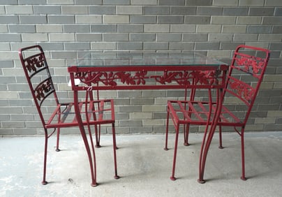 Small wrought iron glass top patio table and 2 matching chairs, in the acorn and leaf pattern, old