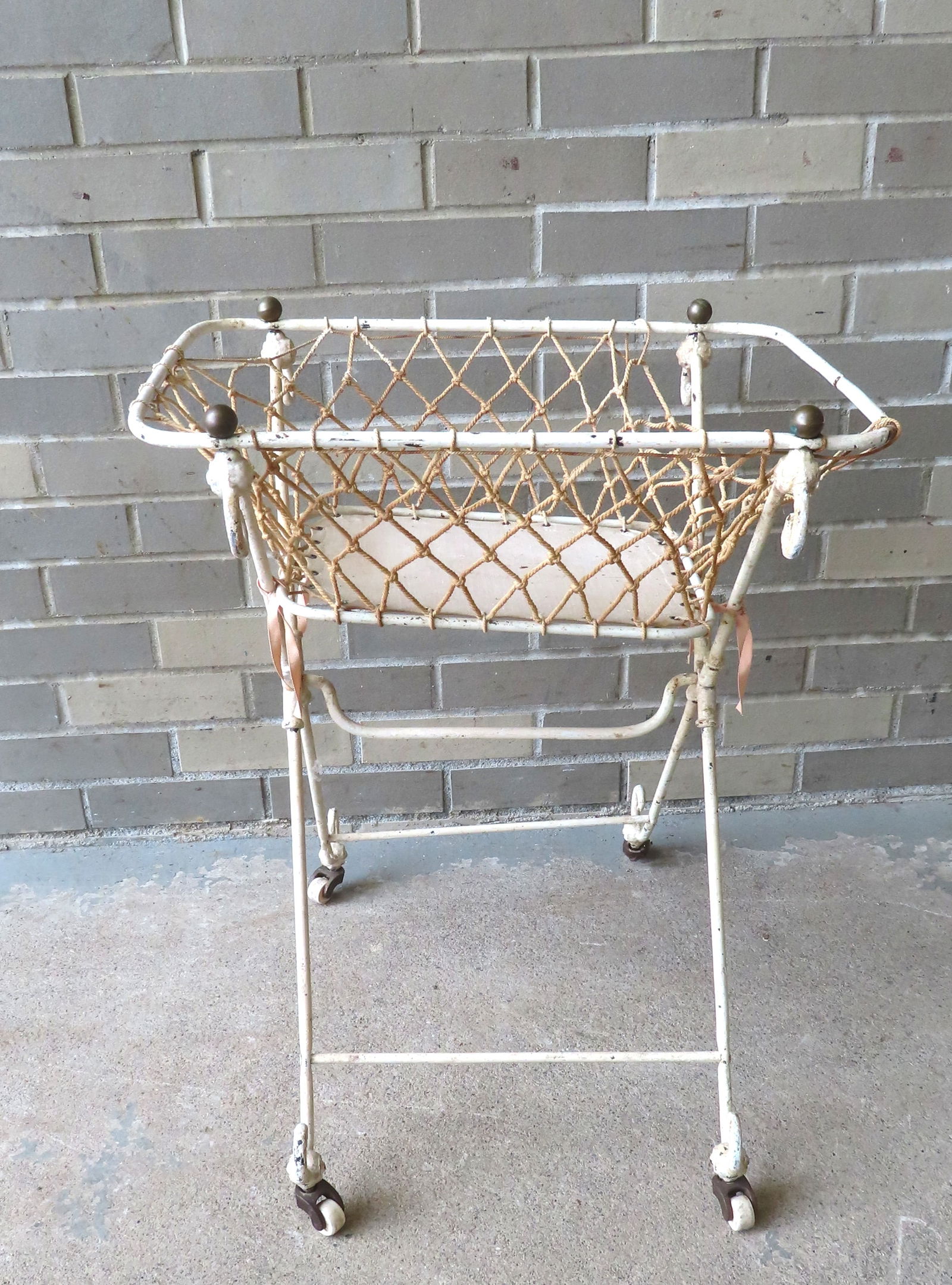 Vintage iron laundry basket with a woven rope basin, mounted on wheels, 19th century. (1 of 7)