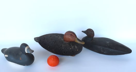 Three decoys including a good cork black duck decoy with a very fine carved head with detailed