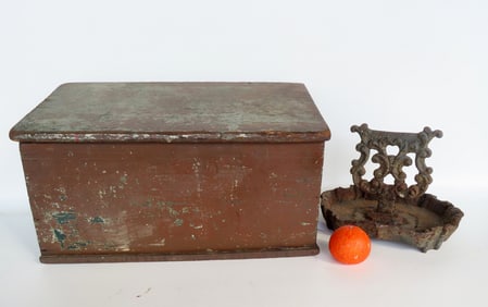 Two country collectibles: The first, a cast iron boot scraper with shaped cast iron platform, found
