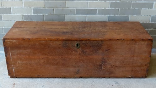 An oak blanket box with rattail hinges, late 18th century, with original iron lock and hasp - some