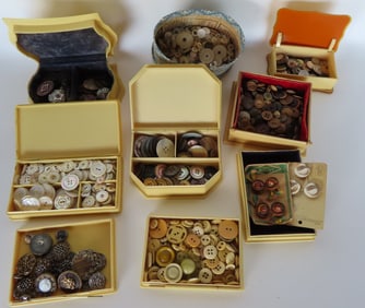 A large grouping of buttons, some in celluloid boxes. See photos for details.