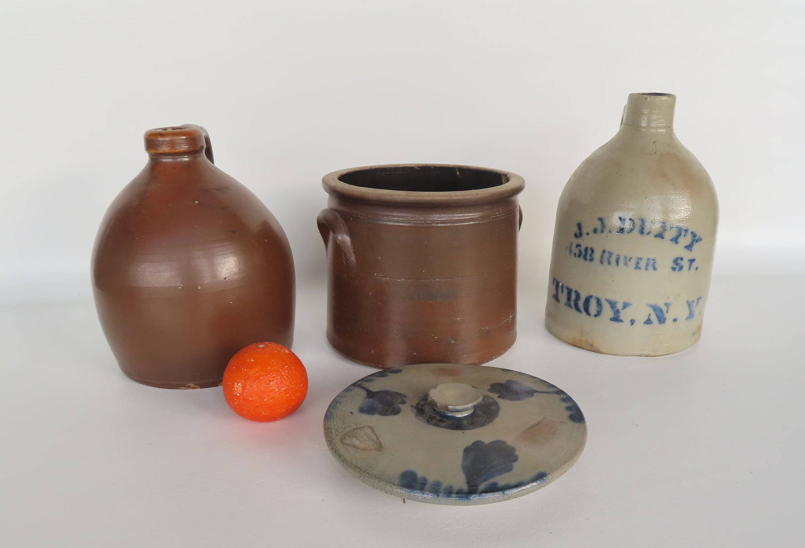 Grouping of 3 pieces of stoneware including: 1 gallon jug signed in blue J.J. Duffy 158 River St. (1 of 5)