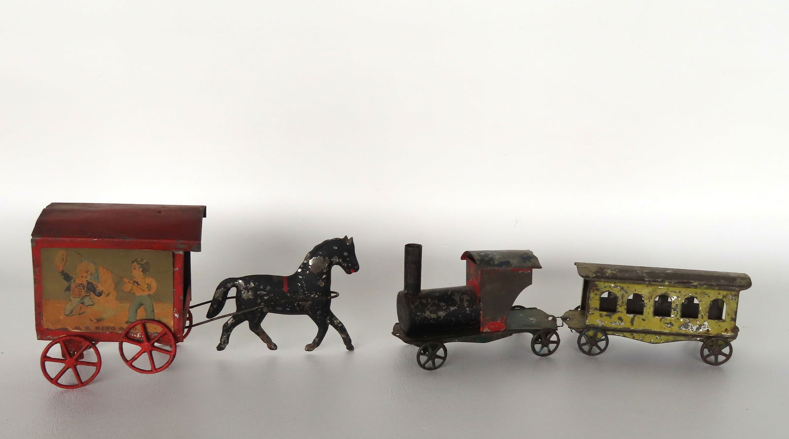 Two tin toys, 19th century in original paint including: Steam locomotive with yellow passenger car, (1 of 12)