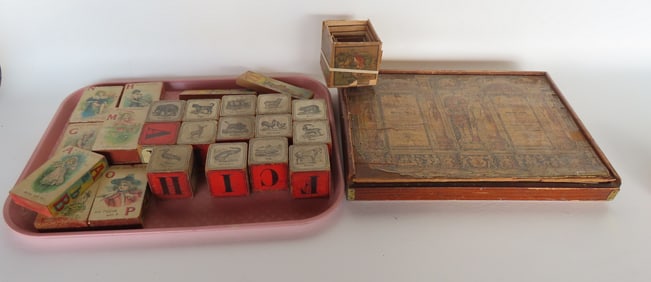 A grouping of 19th century child's blocks including: A stacking set with applied lithograph paper on
