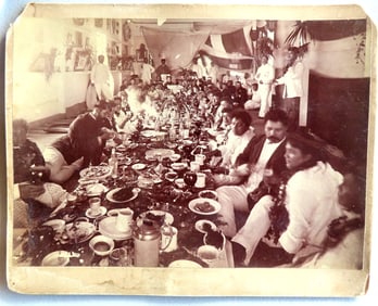 Photo of a royal Hawaiian feast with King Kalakaua seated a table. The feast to honor Mr. & Mrs.