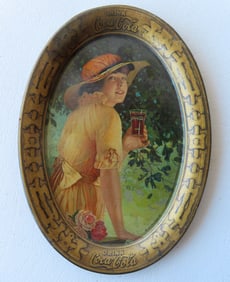 A vintage Coca-Cola tip tray depicting a fashion lady named "Elaine" 1916 - good condition. Measures
