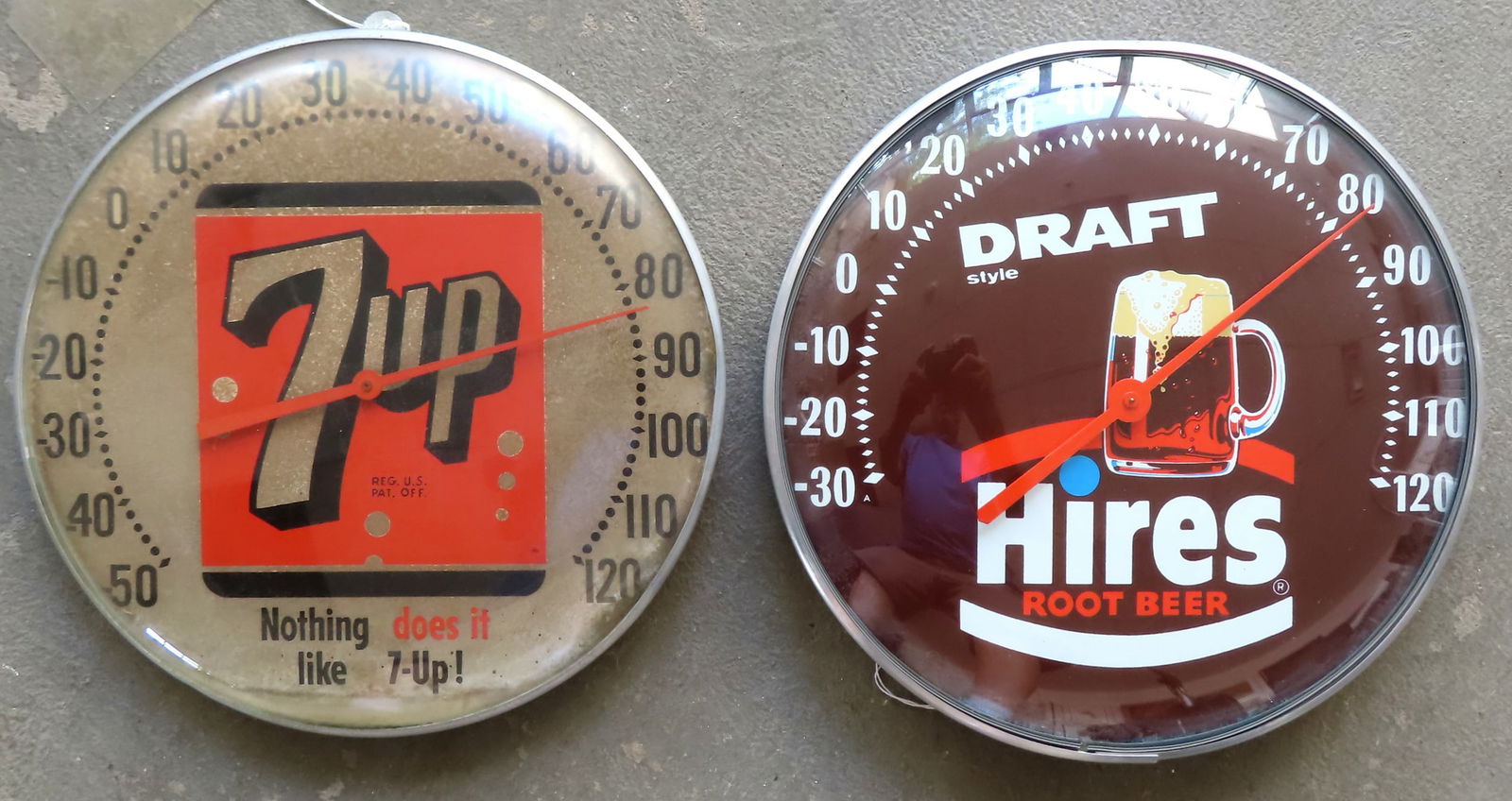 Two circular advertising wall thermometers, each with 12" diameters. The first for "Hires Root Beer (1 of 5)