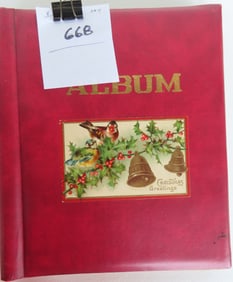 Album of 76 New Years and Christmas postcards, most 1906-1917. Contains, Santa's, angels, and young