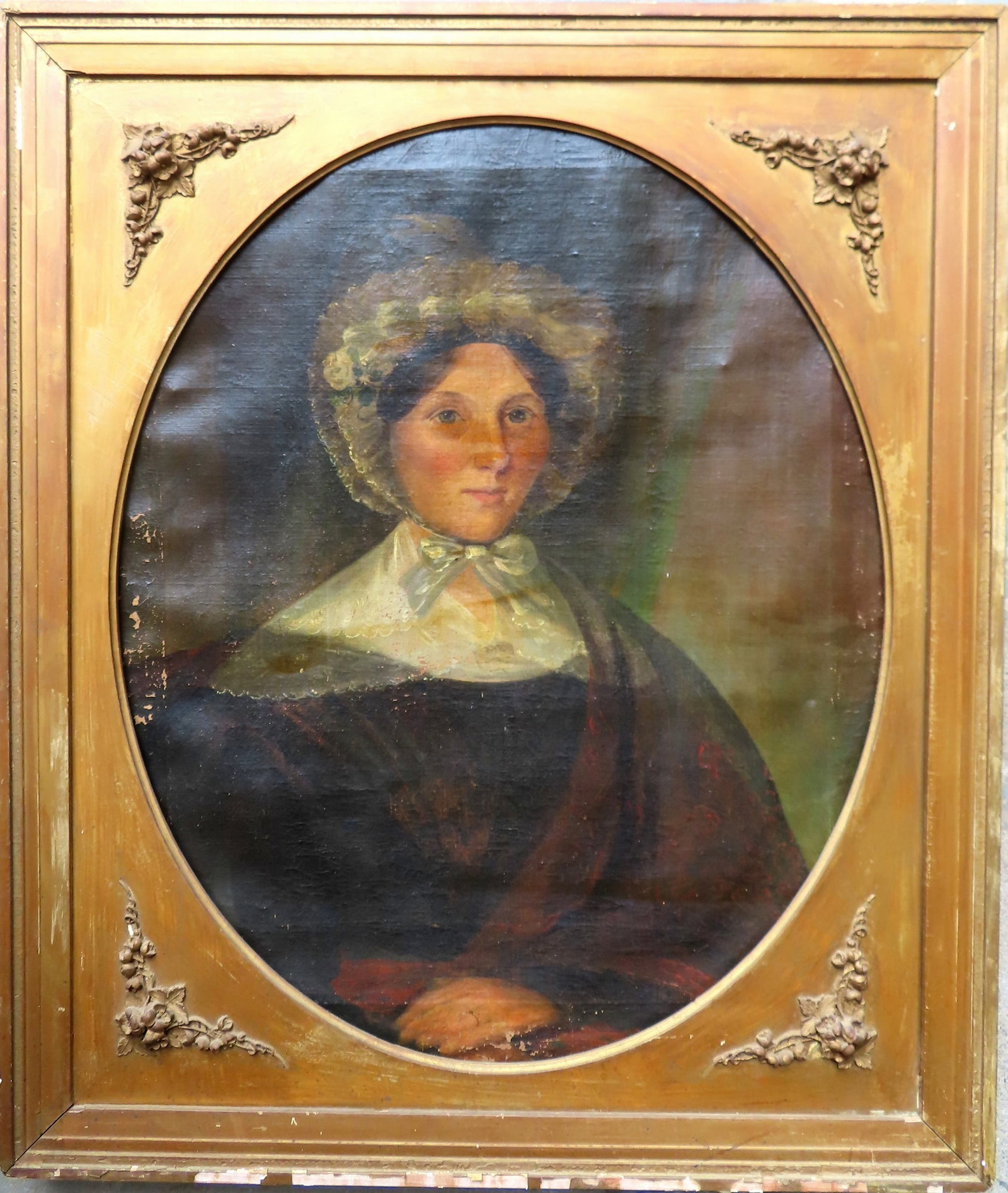O/C Portrait of a lady wearing bonnet and a lace collar, early to mid 19th century. The painting wit: O/C Portrait of a young lady wearing bonnet and a lace collar, early to mid 19th century. The painting with minor losses along the edges, darkening of varnish in some areas, but overall good condition