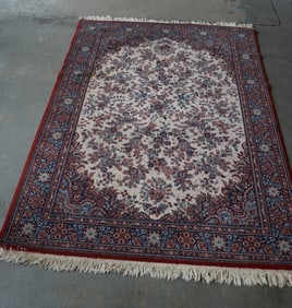 A small oriental room size rug, machine made, late 20th century in good condition.