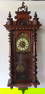 A Renaissance Revival English Wall Clock, circa 1875.
