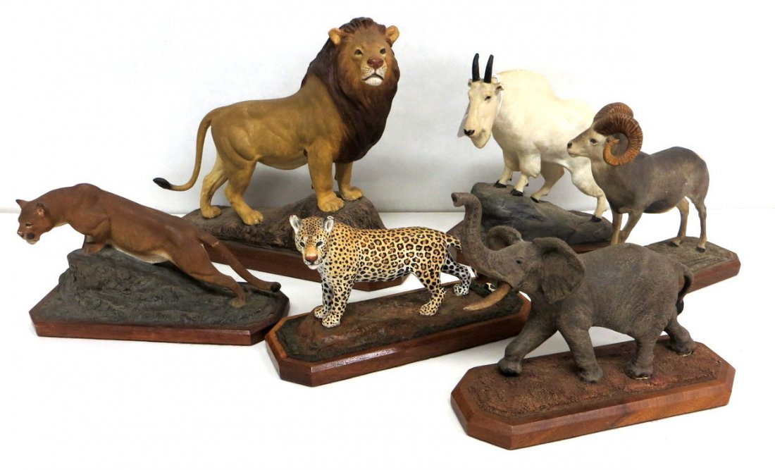 Six hand painted animals including lion, leopard (repai: Six hand painted animals including lion, leopard (repaired tail), elephant (missing one tusk), mountain goat (losses to horns), mountain lion (repaired tail), ram (one horn with chip on tip) - . Signe