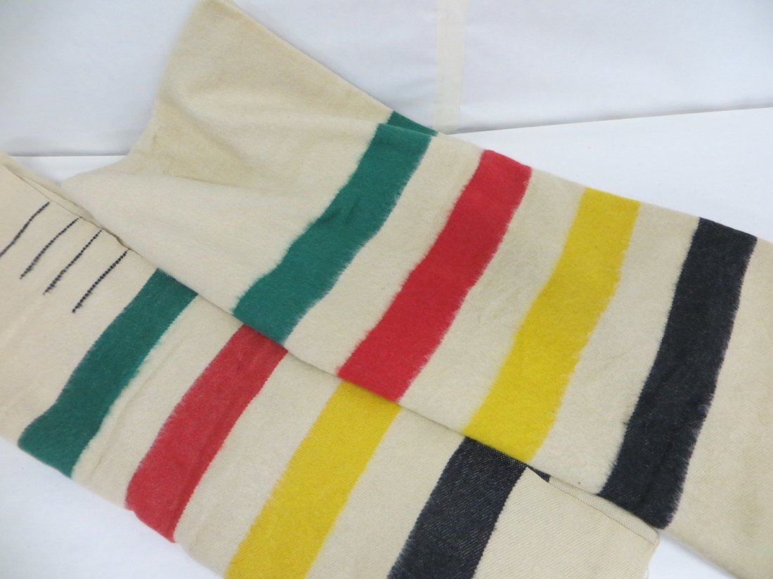 Two natural Hudson Bay style point blankets with green,: Two natural Hudson Bay style point blankets with green, red, yellow and black stripes. Note - no label present, but these are believed to be an early version of this style blanket. Provenance: From th