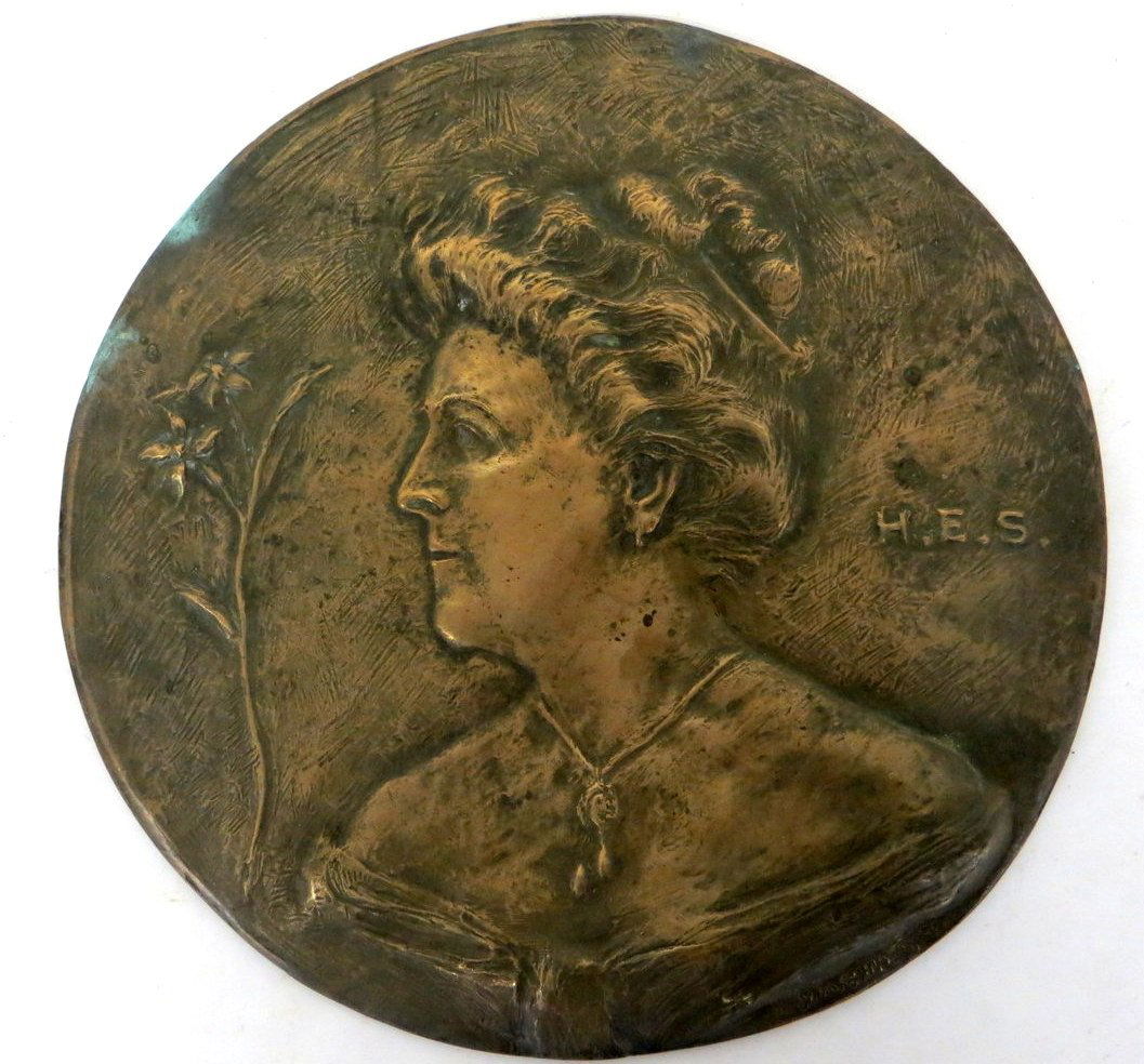 Circular bronze wall plaque of Edwardian lady inscribed: Circular bronze wall plaque of Edwardian lady inscribed H.E.S. (Possibly wife of artist) signed H.M. Shrady (Henry Merwin Shrady 1871-1922 NY) - 9.5"D. Provenance: From the estate of John Whiteford, W